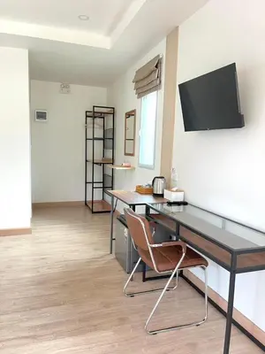 an office with a desk and a chair in a room at Koh Yao Modern Inn -SHA Plus in Ko Yao Yai
