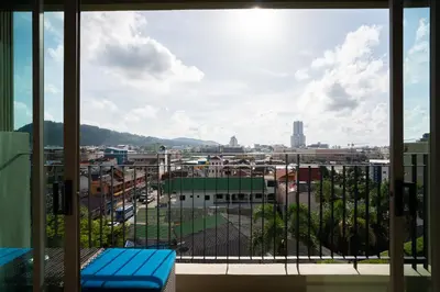 a view of a city from a window at The Senses Resort & Pool Villas, PHUKET in Patong Beach