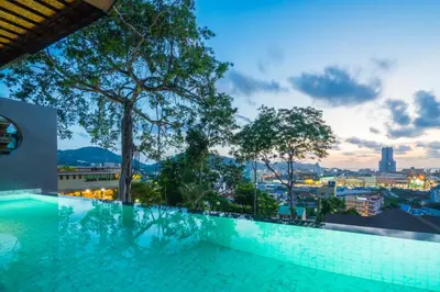 a pool on the roof of a building with a view at The Senses Resort & Pool Villas, PHUKET in Patong Beach