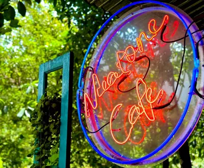 a neon sign that says happy new year at Nua Tone Resort Bang Tao & Cafe in Bang Tao Beach