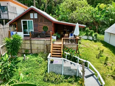 a small house with a deck and a porch at Resting Place Ko Yao Yai in Ko Yao Yai