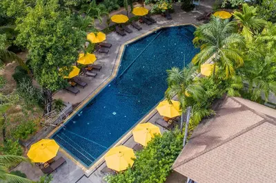 an overhead view of a swimming pool with umbrellas at Nai Yang Beach Resort and Spa in Nai Yang Beach