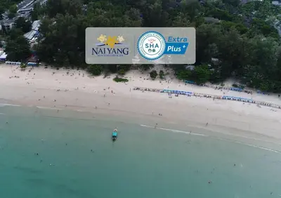 an aerial view of a beach with a sign at Nai Yang Beach Resort and Spa in Nai Yang Beach
