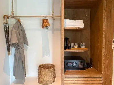 a small kitchen with a microwave in a room at Baan Taranya Koh Yao Yai Resort in Ko Yao Yai