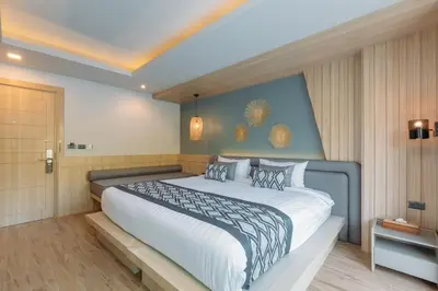 a bedroom with a large bed in a room at Baan Taranya Koh Yao Yai Resort in Ko Yao Yai