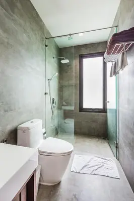 a bathroom with a toilet and a glass shower at Villa Palavee (A2) in Ao Nang Beach