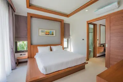 a bedroom with a white bed and a window at Villa Palavee (A2) in Ao Nang Beach