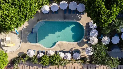 an overhead view of a swimming pool with umbrellas at Phuket Island View Resort - SHA Extra Plus in Karon Beach