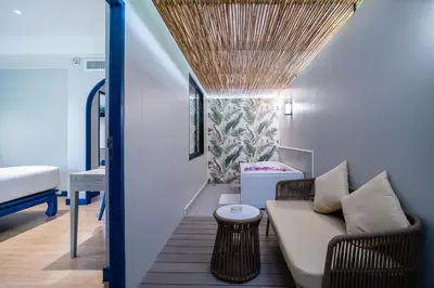a living room with a couch and a bed at Phuket Island View Resort - SHA Extra Plus in Karon Beach