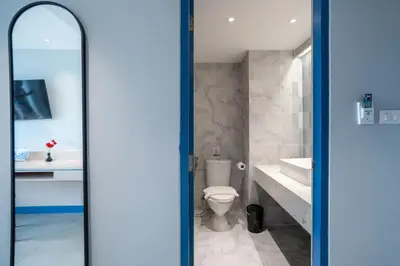 a bathroom with a toilet and a sink at Phuket Island View Resort - SHA Extra Plus in Karon Beach