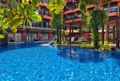 a large swimming pool in front of a building at Courtyard by Marriott Phuket, Patong Beach Resort in Patong Beach