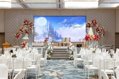 a set up for a wedding with a projection of the disney castle at Phuket Merlin Hotel in Phuket Town