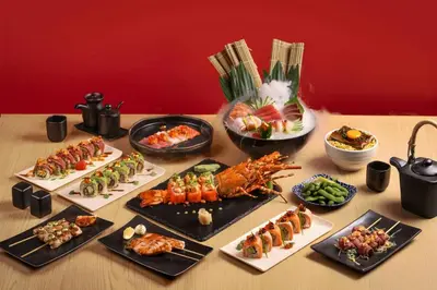 a table topped with different types of food on plates at Phuket Marriott Resort & Spa, Merlin Beach in Patong Beach
