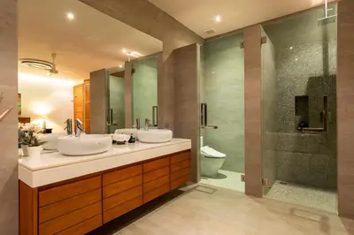 a bathroom with two sinks and a shower at Luxurious SeaView 4br Private Pool Villa by Intira Villas in Rawai Beach