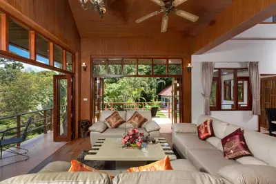 a living room with couches and a table at Patong Hill Estate 6 in Patong Beach