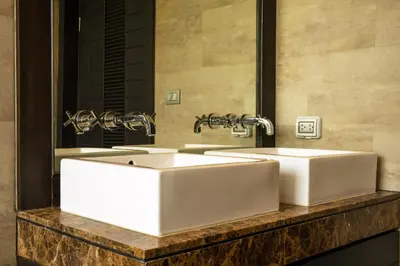 a bathroom with two white sinks and a mirror at Amazing 5br, Seaview private PoolVilla by Intira Villas in Rawai Beach