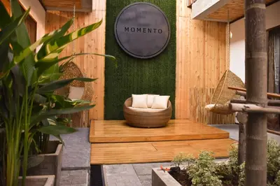 a sign on the side of a building with a wicker bowl at Momento Bangtao Beach in Bang Tao Beach