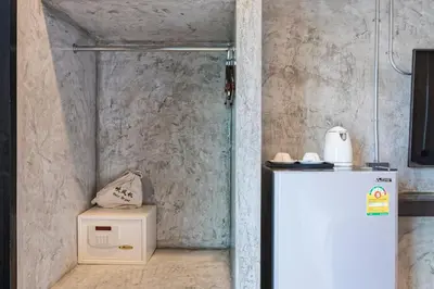 a white refrigerator in a room with a wall at My Style Resort Hotel -SHA Plus in Patong Beach