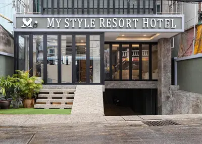 a building with a sign that reads my style resort hotel at My Style Resort Hotel -SHA Plus in Patong Beach
