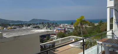 a balcony with a view of a city at Villa Versace Residence in Patong Beach