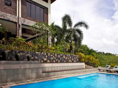 a swimming pool in front of a house at Thara Bayview Villa, SHA Certified in Ao Nang Beach