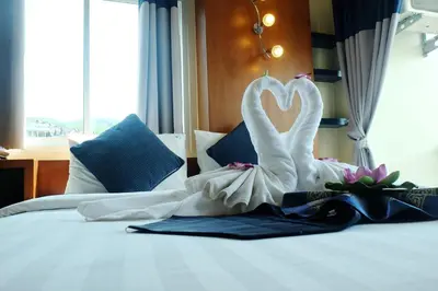 a swan dressed up on a bed in a hotel room at Calypso Patong Hotel in Patong Beach