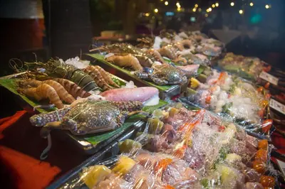 a buffet of seafood and other foods on display at Kata Poolside Resort SHA Extra Plus in Kata Beach