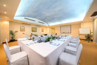 a large meeting room with a long table and chairs at Andaman Beach Suites Hotel, Patong Phuket in Patong Beach
