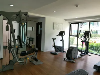 a gym with several treadmills and elliptical machines at 5 Floor - Centrio Condominium in Phuket Town - 30 mins to beaches in Phuket Town