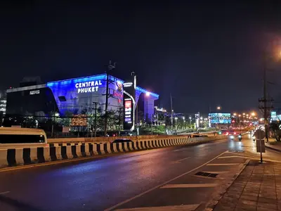 a city street at night with a building with blue lights at 5 Floor - Centrio Condominium in Phuket Town - 30 mins to beaches in Phuket Town