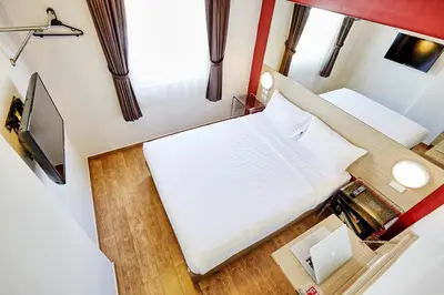 an overhead view of two beds in a tiny house at Easy Planet Phuket Patong in Patong Beach