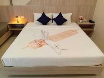 a bed with a person made out of towels on it at The Way Patong Hotel in Patong Beach