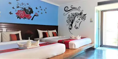 two beds in a room with two at D2 lamoon resotel in Phuket Town