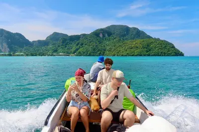 a group of people on a boat in the water at Phi Phi Sea Sky Resort in Phi Phi Don