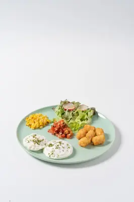 a plate with different types of food on it at Sugar Ohana Poshtel in Kata Beach