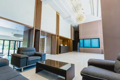 a living room with two couches and a coffee table at The Aristo by Holy Cow, 2-BR, mountain view in Bang Tao Beach