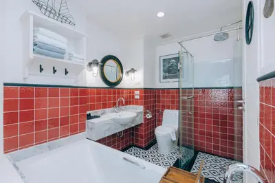 a bathroom with a shower and a sink and a toilet at Sugar Marina Hotel - NAUTICAL - Kata Beach in Kata Beach