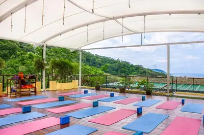 a yoga room with yoga mats on the floor at CC's Hideaway Kata - SHA Plus in Kata Beach