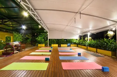 a large room with colorful mats on the floor at CC's Hideaway Kata - SHA Plus in Kata Beach