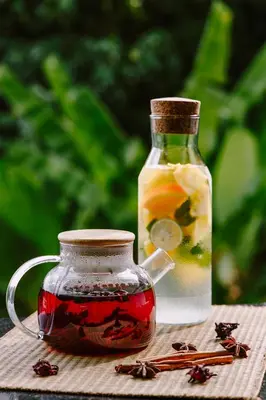 a glass jar of tea and a bottle of honey at CC's Hideaway Kata - SHA Plus in Kata Beach