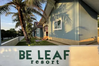 a be leaf resort sign in front of a house at Be Leaf Resort SHA in Thalang