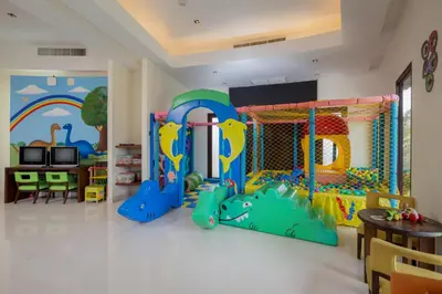 a childrens play room with a play set at The Vijitt Resort Phuket - SHA Extra Plus in Rawai Beach