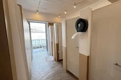 a hallway with a room with a speaker on the wall at Our Nomad Boutique Hostel in Phuket Town