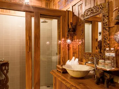 a bathroom with a sink and a mirror at Santhiya Phuket Natai Resort & Spa in Natai Beach
