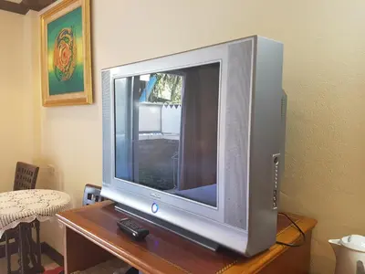 a flat screen tv sitting on top of a table at Phi Phi Hotel in Phi Phi Don