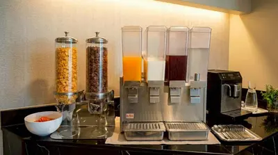 a kitchen counter with a food processor and a blender at Beehive Boutique Hotel Phuket in Phuket Town