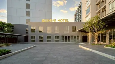 an empty parking lot in front of a hotel at Beehive Boutique Hotel Phuket in Phuket Town