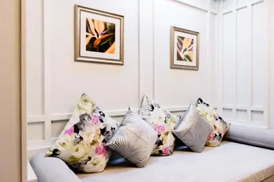 a living room with pillows on a couch at Villa Pimmada in Ao Nang Beach