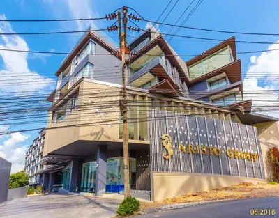 a building with a school sign in front of it at The Aristo Beach by Holy Cow, studio, construction view in Surin Beach
