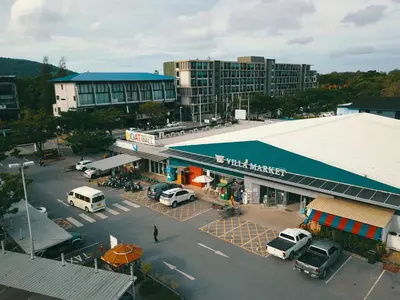 an aerial view of a parking lot in a city at The Aristo Beach by Holy Cow, studio, construction view in Surin Beach